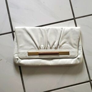 Vintage elegant white strapless leather purse, blue velvet inside snaps to close